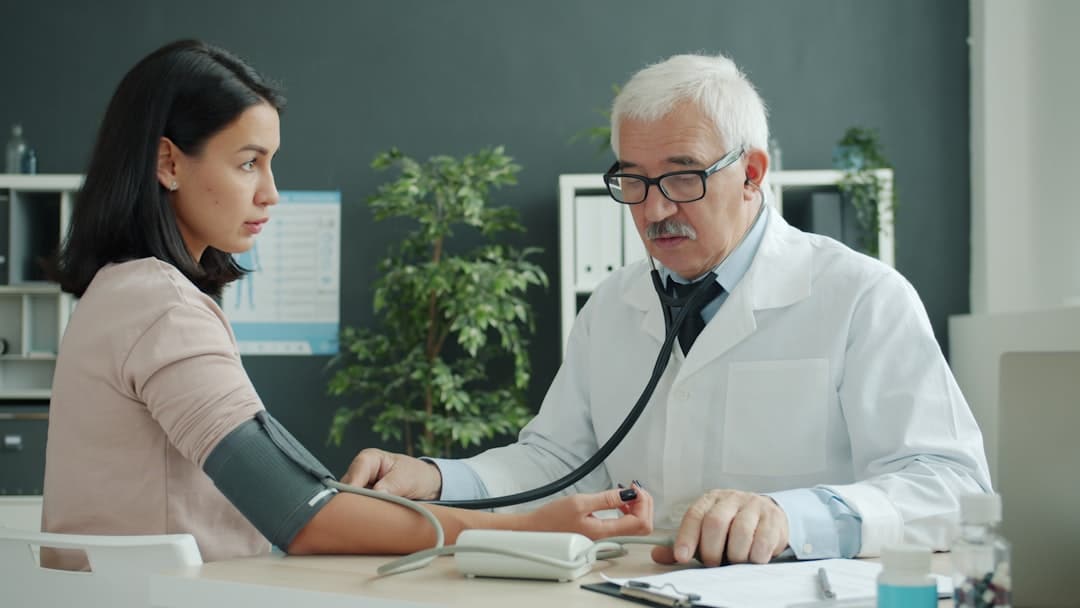 Weight Loss Clinic | Peptide Therapy Guide: Uses, Evidence & Regulatory Status Physician performing a medical evaluation before considering treatment options