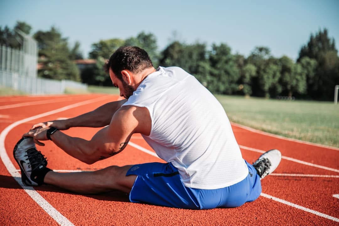 Athlete stretching as part of a recovery and rehabilitation program